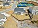 Aerial view highlighting the backyard, proximity to neighborhood amenities like tennis courts at 814 Parker Pass, Peachtree City, GA 30269