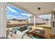 The covered back porch has a large outdoor seating area with a view of the backyard at 814 Parker Pass, Peachtree City, GA 30269