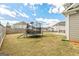 Spacious backyard featuring a trampoline, green space, and privacy fence at 814 Parker Pass, Peachtree City, GA 30269
