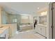A large bathroom features double sinks, a separate shower, and a tub with a window at 814 Parker Pass, Peachtree City, GA 30269