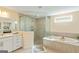 This primary bathroom features double sinks, a separate shower, and a soaking tub at 814 Parker Pass, Peachtree City, GA 30269