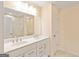 Elegant bathroom with double sinks, a white marble countertop, and tiled floor at 814 Parker Pass, Peachtree City, GA 30269