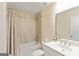 Neutral bathroom with granite-look tiled walls and shower with sink and toilet at 814 Parker Pass, Peachtree City, GA 30269