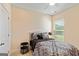 Comfortable bedroom featuring a patterned bedspread and ample natural light at 814 Parker Pass, Peachtree City, GA 30269