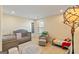Comfortable Bedroom features a crib, cozy chair, and playful decor at 814 Parker Pass, Peachtree City, GA 30269