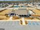 An aerial view of the community clubhouse, with a covered area, landscaping, and accessible parking at 814 Parker Pass, Peachtree City, GA 30269