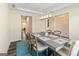 Dining room with tray ceiling, modern chandelier, and a glimpse into other rooms at 814 Parker Pass, Peachtree City, GA 30269