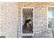 Open view through the front door showcasing hardwood floors, stone walls, and an inviting interior at 814 Parker Pass, Peachtree City, GA 30269