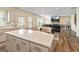 Bright kitchen with quartz countertop island open to a dining area at 814 Parker Pass, Peachtree City, GA 30269