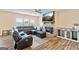 Spacious living room featuring a stone fireplace and a large sectional sofa at 814 Parker Pass, Peachtree City, GA 30269