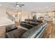 Open-concept living room leading to the kitchen with a large sectional sofa at 814 Parker Pass, Peachtree City, GA 30269