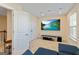 Bright living room features a large television and comfortable seating area at 814 Parker Pass, Peachtree City, GA 30269