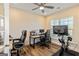 Bright office space with a desk, multiple monitors, ergonomic chairs, and a Peloton bike at 814 Parker Pass, Peachtree City, GA 30269