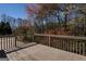 Relaxing wood deck offering scenic views of the surrounding trees and landscape, perfect for outdoor enjoyment at 1491 Hada Ln, Lawrenceville, GA 30044