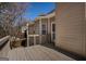 Wood deck showcasing siding and a cozy outdoor nook, with steps down into the yard at 1491 Hada Ln, Lawrenceville, GA 30044