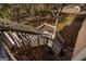 Back stairs leading down into the stone-lined backyard. The yard features a sloped landscape with mature trees at 1491 Hada Ln, Lawrenceville, GA 30044