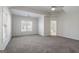Spacious bedroom with carpet, multiple windows, and ceiling fan at 1491 Hada Ln, Lawrenceville, GA 30044