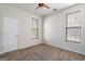 Bedroom with neutral carpeting and two windows at 1491 Hada Ln, Lawrenceville, GA 30044