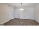 Bright dining area boasting natural light and chandelier lighting, carpeted, ready for memorable gatherings at 1491 Hada Ln, Lawrenceville, GA 30044