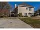 Rear exterior view with a charming balcony, well-maintained backyard, and ample parking space at 1491 Hada Ln, Lawrenceville, GA 30044