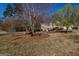 Traditional two-story home with manicured front yard and mature trees in a peaceful, residential neighborhood at 1491 Hada Ln, Lawrenceville, GA 30044