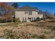 Charming two-story home featuring a well-maintained lawn, traditional siding, and complementing dark green shutters at 1491 Hada Ln, Lawrenceville, GA 30044