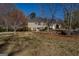 Charming two-story home with traditional siding, complimented by lush trees and a spacious front yard at 1491 Hada Ln, Lawrenceville, GA 30044
