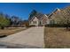 Attractive home with lush lawn, long driveway and a combination of stone and siding at 1491 Hada Ln, Lawrenceville, GA 30044
