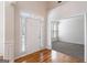 Welcoming foyer with hardwood floors, a front door with sidelights, and a view into an adjacent room at 1491 Hada Ln, Lawrenceville, GA 30044