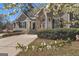 Charming home with stone accents, an American flag, and landscaped grounds at 1491 Hada Ln, Lawrenceville, GA 30044