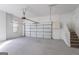 Bright and spacious two-car garage with an open interior and staircase, ideal for parking and storage at 1491 Hada Ln, Lawrenceville, GA 30044
