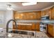Spacious kitchen featuring wooden cabinets, granite countertops, and stainless steel appliances at 1491 Hada Ln, Lawrenceville, GA 30044