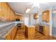 Bright kitchen with wood cabinets, stainless steel appliances and granite countertops at 1491 Hada Ln, Lawrenceville, GA 30044