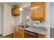 Kitchen featuring granite counters, stainless steel appliances, and wood cabinets at 1491 Hada Ln, Lawrenceville, GA 30044