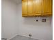 Laundry room with tile floor and upper cabinets at 1491 Hada Ln, Lawrenceville, GA 30044