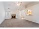 Living room features vaulted ceilings, a fireplace, neutral carpet and a ceiling fan at 1491 Hada Ln, Lawrenceville, GA 30044
