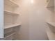 A well-lit pantry featuring white shelves and ample storage space at 1491 Hada Ln, Lawrenceville, GA 30044
