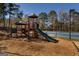 Community playground featuring a slide, climbing structures, and a swing set, perfect for Gathering fun at 1491 Hada Ln, Lawrenceville, GA 30044