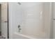Shower with white surround and silver fixtures at 1491 Hada Ln, Lawrenceville, GA 30044