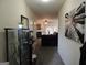 Hallway leading to an inviting living room with fireplace, offering a glimpse of comfortable living at 2742 Keystone Gates Ct, Lithonia, GA 30058