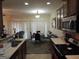 Functional kitchen featuring wood cabinets, a complete appliance package, and an adjacent dining area at 2742 Keystone Gates Ct, Lithonia, GA 30058