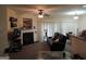 Comfortable living room featuring a cozy fireplace and ample natural light, perfect for relaxation at 2742 Keystone Gates Ct, Lithonia, GA 30058