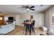 View of eating area from living room. Long table and bar-style seating at 327 Old Muse Rd, Carrollton, GA 30116