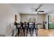 Eating area includes bar-height table with plenty of seating and light from french doors at 327 Old Muse Rd, Carrollton, GA 30116