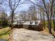 An eye-level exterior view shows the home's facade, garage, and mature trees on a large lot at 327 Old Muse Rd, Carrollton, GA 30116