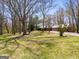 View of the home's facade, garage, and large front yard at 327 Old Muse Rd, Carrollton, GA 30116