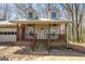 A charming single-story home with dormer windows and a cozy front porch at 327 Old Muse Rd, Carrollton, GA 30116