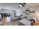 Comfortable living room with neutral colors, ceiling fan, and view of eating area at 327 Old Muse Rd, Carrollton, GA 30116