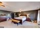 Large main bedroom boasts a ceiling fan, carpet flooring, and traditional wood furnishings at 327 Old Muse Rd, Carrollton, GA 30116