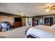Expansive main bedroom with exposed brick wall, neutral carpet, and ensuite access at 327 Old Muse Rd, Carrollton, GA 30116